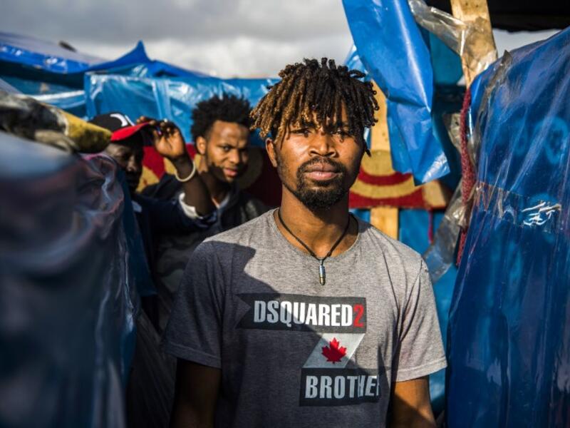A sub-Saharan migrant walks between make-shift tents in the Oulad Ziane migrant camp in Casablanca on March 27, 2019. 
FADEL SENNA / AFP