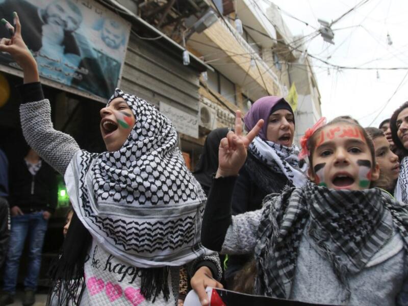 Palestinian women and children take part in a protest in the refugee camp of Ain el-Helwe on the outskirts of the southern Lebanese port city of Sidon Dec. 8, 2017 to denounce the widely criticised U.S. decision to recognize Jerusalem as the capital of Israel (Mahmoud Zayyat/AFP)