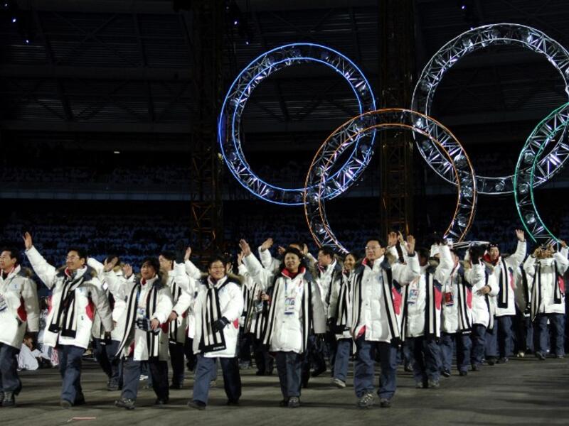 This file photo taken on February 10, 2006 shows South Korean and North Korean athletes marching together during the opening ceremony of the 2006 Winter Olympics at the Olympic stadium in Turin (ERIC FEFERBERG / AFP)
