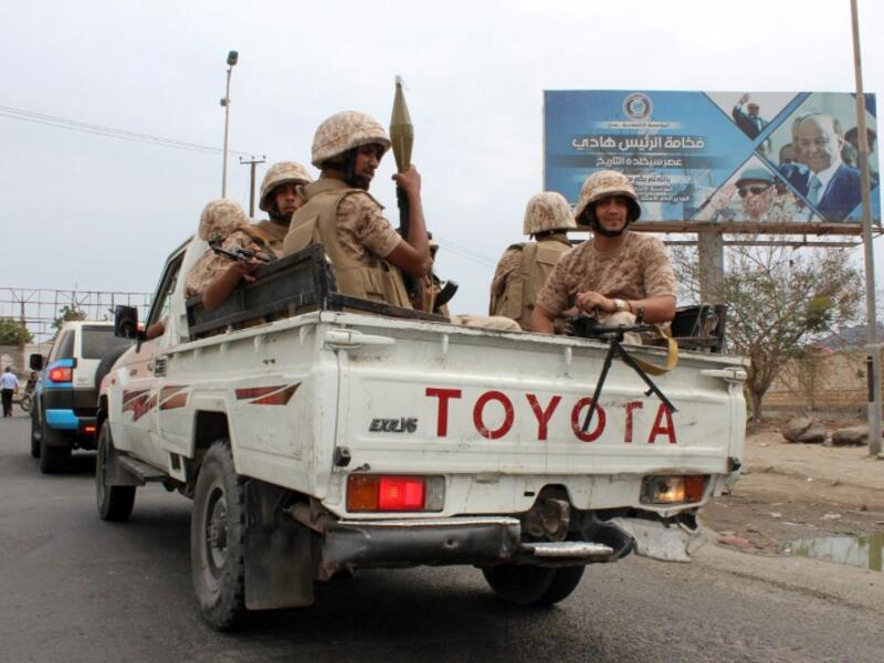 Fighters from Yemen's southern separatist movement sit in the back of a pick-up truck in the country's second city of Aden on Jan. 28, 2018, during clashes with forces loyal to the Saudi-backed president (SALEH AL-OBEIDI / AFP)