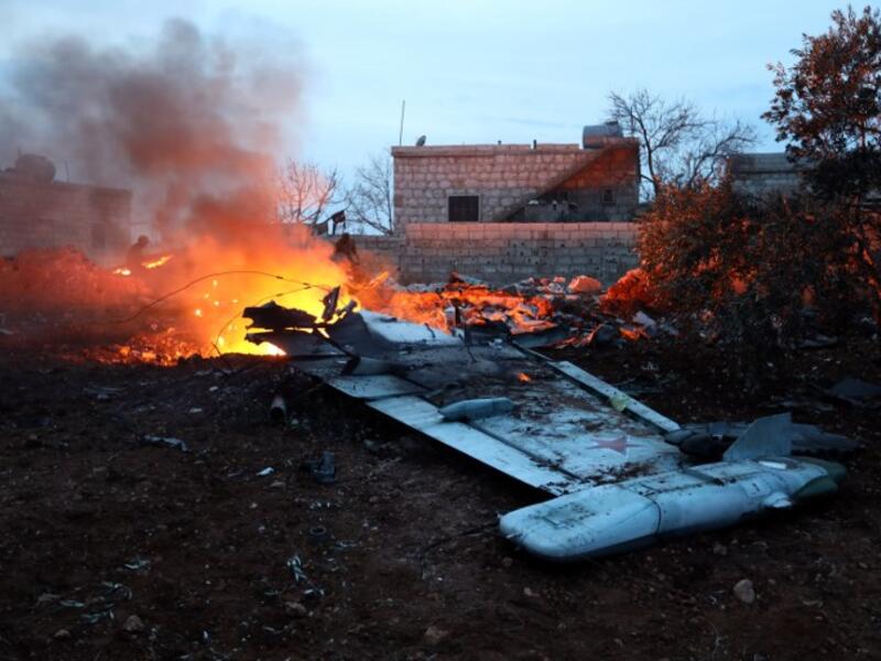 A picture taken on February 3, 2018, shows smoke billowing from the site of a downed Sukhoi-25 fighter jet in Syria's northwest province of Idlib. Rebel fighters shot down a Russian plane over Syria's northwest Idlib province and captured its pilot, the Syrian Observatory for Human Rights said. (OMAR HAJ KADOUR / AFP)