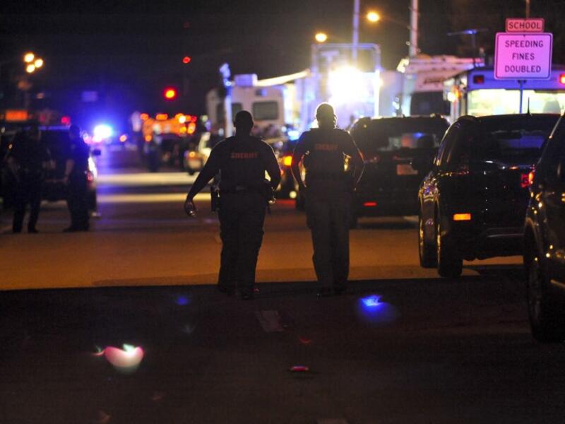 Police vehicles block the road to Marjory Stoneman Douglas High School in Parkland, Florida, following a shooting that killed 17 people on Feb. 14, 2018 in Parkland, Florida. (Gaston De Cardenas / AFP)