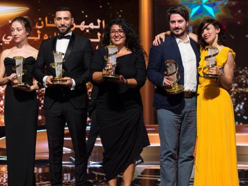 Sudabeh Mortezai (center) poses with her trophy. (Source: AFP)