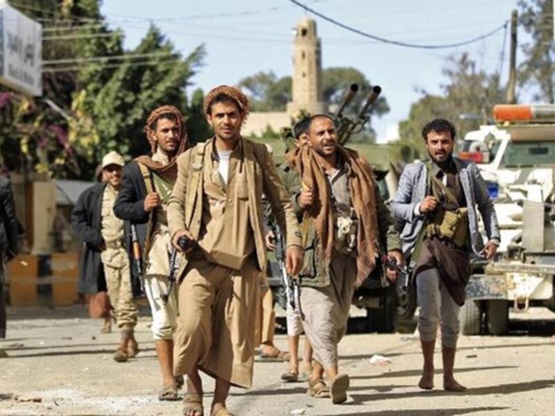 Houthi rebel fighters are seen outside of the residence of Yemen's former President Ali Abdullah Saleh in Sanaa. AFP/Mohammed Huwais