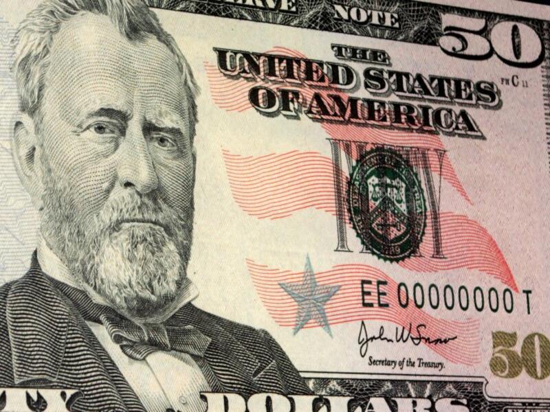 A weak dollar means the potential for a global currency war is strong. (File photo)