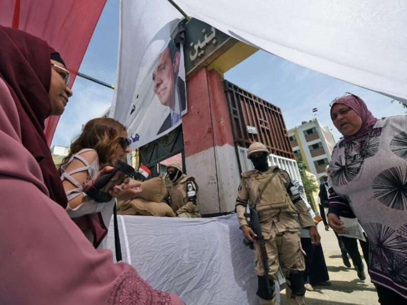 Balloting on elections day as one of the electorate casting vote (AFP/File Photo).