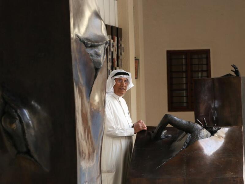 Kuwaiti sculptor Sami Mohammed poses next to his work at the Museum of Modern Art in Kuwait City on October 4, 2018. 
Yasser Al-Zayyat / AFP