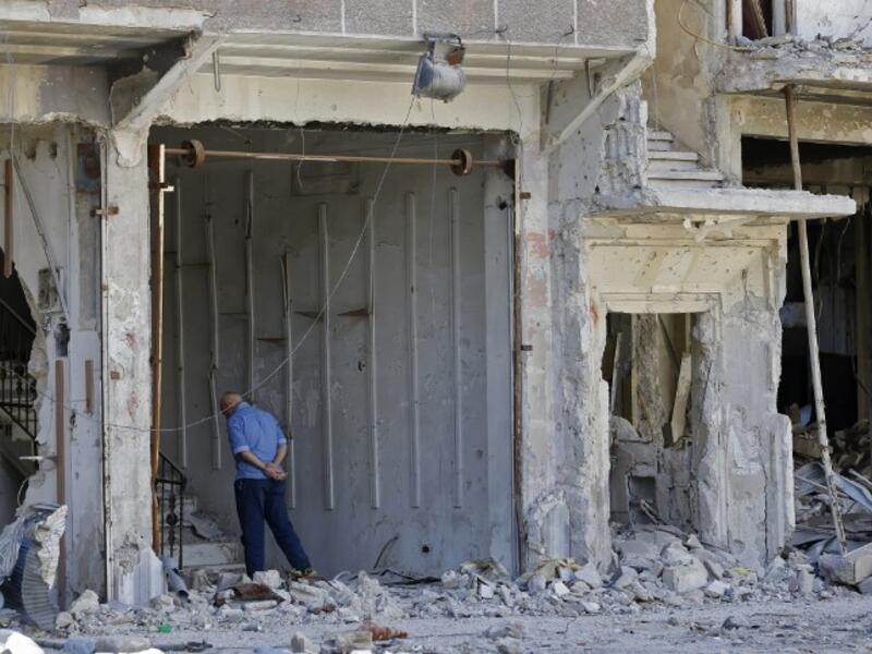 A man stands near a destroyed building in the Palestinian camp of Yarmuk southern Damascus on November 1, 2018. 
LOUAI BESHARA / AFP