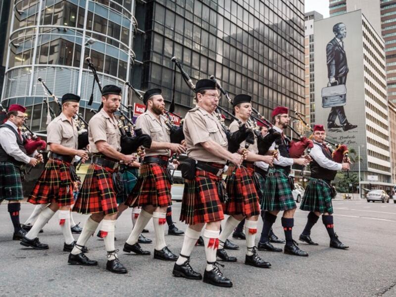 Pipers part of a military orchestra take part in a Sunset Parade in Durban, on November 11, 2018 as part of commemorations marking the 100th anniversary of the 11 November 1918 armistice, ending World War I. 
RAJESH JANTILAL / AFP