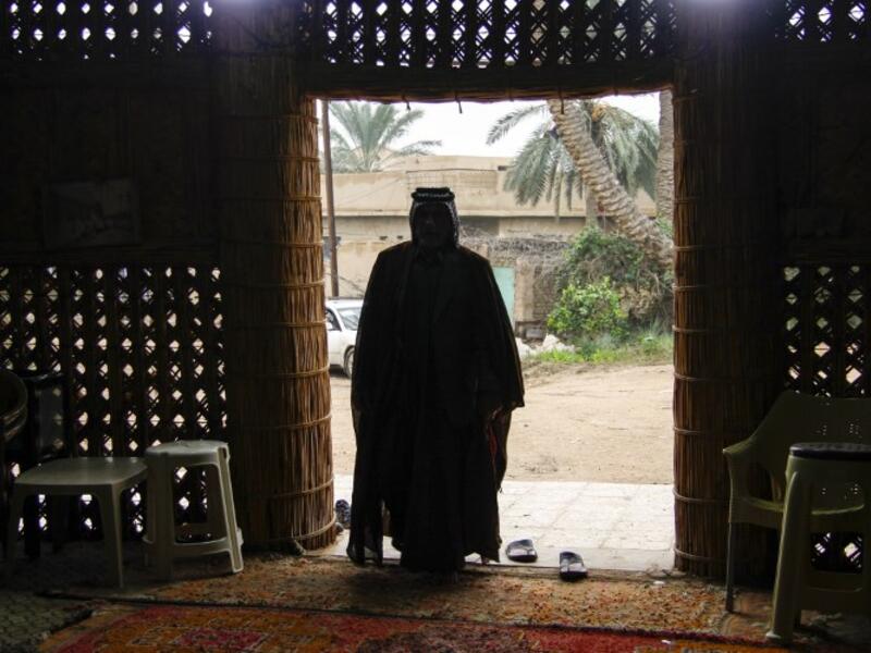 A member of an Iraqi clan enters a straw tent in the town of Mishkhab, south of Najaf on November 15, 2018. 
Haidar HAMDANI / AFP