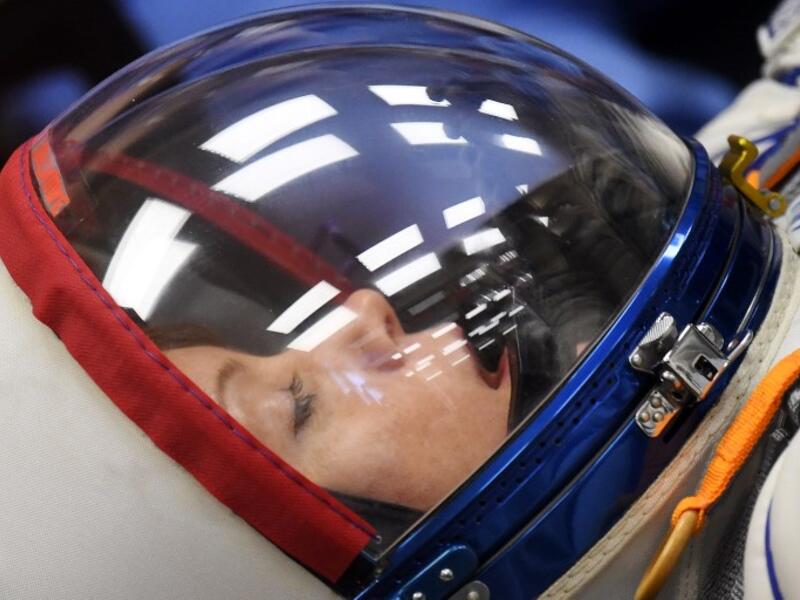 NASA astronaut Anne McClain, a member of the International Space Station (ISS) expedition 58/59, reacts as her space suit is tested prior to the launch onboard the Soyuz MS-11 spacecraft at the Russian-leased Baikonur cosmodrome in Kazakhstan on December 3, 2018. 
Kirill KUDRYAVTSEV / AFP