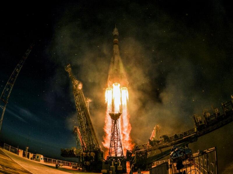 A Soyuz MS-11 rocket carrying Russian, American and Canadian astronauts takes off from the Baikonur Cosmodrome on December 3, 2018 before reached orbit later, the first manned mission since a failed launch in October. 
Kirill KUDRYAVTSEV / AFP