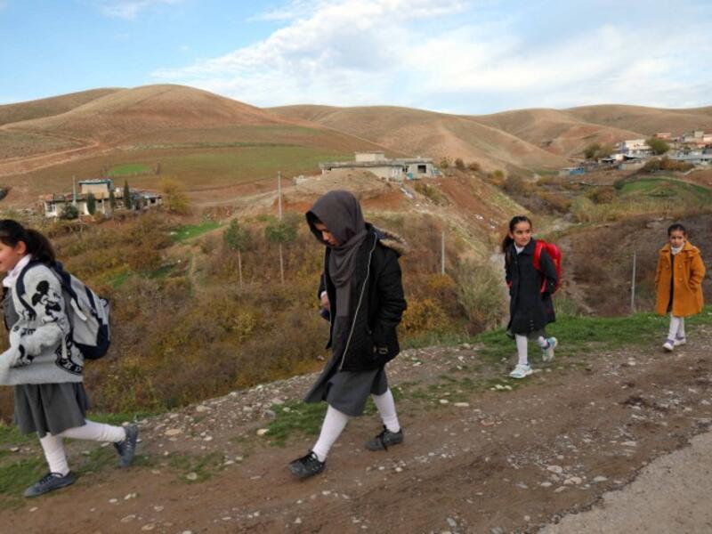 Young girls walk to school in Sharboty Saghira, a small village east of regional capital Arbil.
SAFIN HAMED / AFP