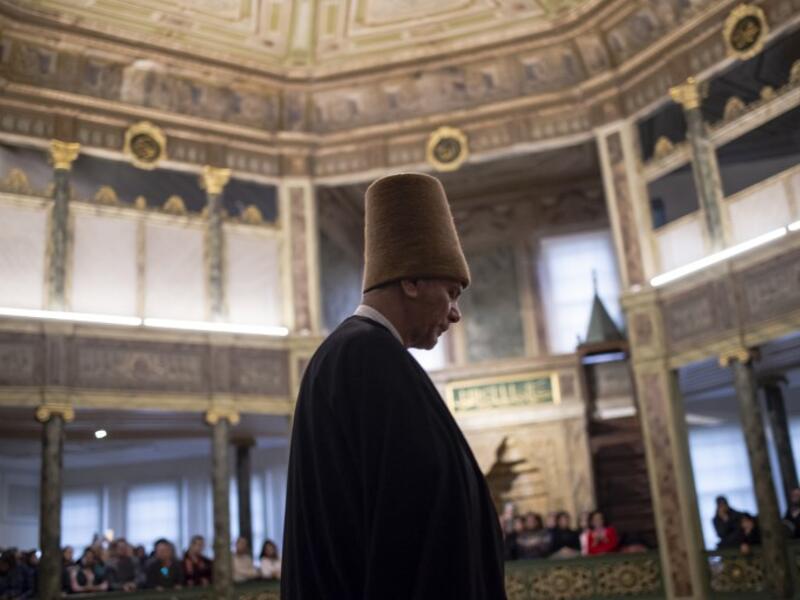 Whirling dervishes perform during a ceremony marking the anniversary of the death of Jelaleddin Mevlana Rumi, Sufi mystic, poet and founder of the sufism on December 16, 2018 at Galata Mevlihanesi in Istanbul. 
Yasin AKGUL / AFP
