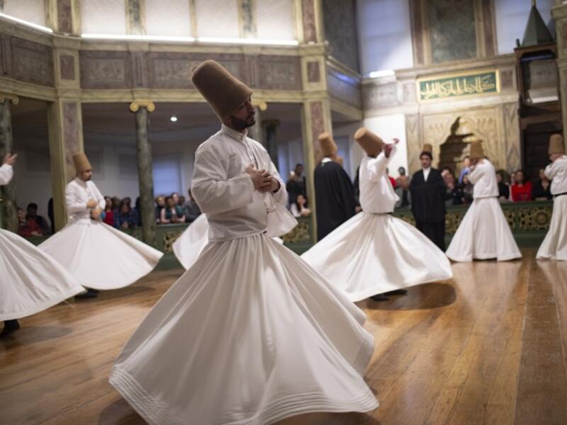 Whirling dervishes perform during a ceremony marking the anniversary of the death of Jelaleddin Mevlana Rumi, Sufi mystic, poet and founder of the sufism on December 16, 2018 at Galata Mevlihanesi in Istanbul. 
Yasin AKGUL / AFP