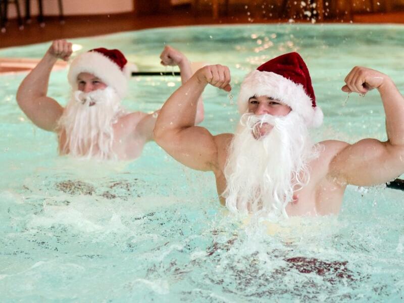 Fitness coaches dressed as Santa Claus pose while doing aqua aeorobics in a pool of the Meridian Spa in Hamburg, northern Germany, during a charity event on December 18, 2018. 
Axel Heimken / dpa / AFP