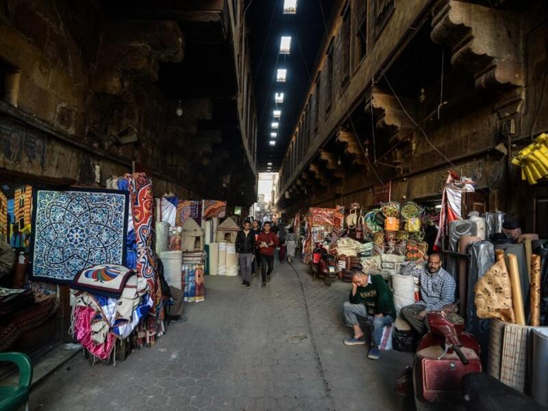 This picture shows a view of shops along the roofed Khayamiya Street, or the Street of Tent-makers, in the old city of the Egyptian capital Cairo. Mohamed el-Shahed / AFP