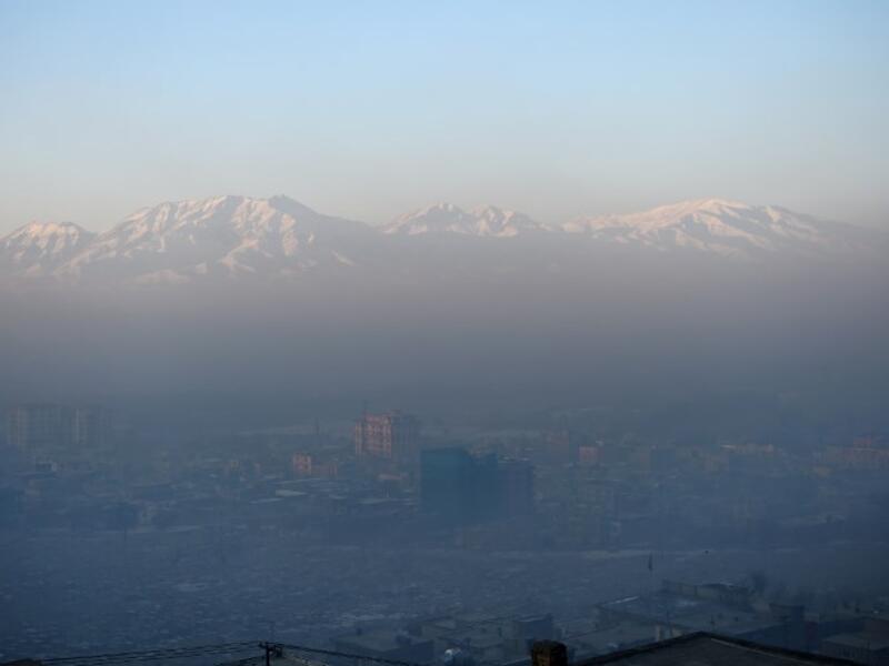 This photograph shows a general view of residential areas amid heavy smog conditions in Afghanistan's capital Kabul. 
WAKIL KOHSAR / AFP