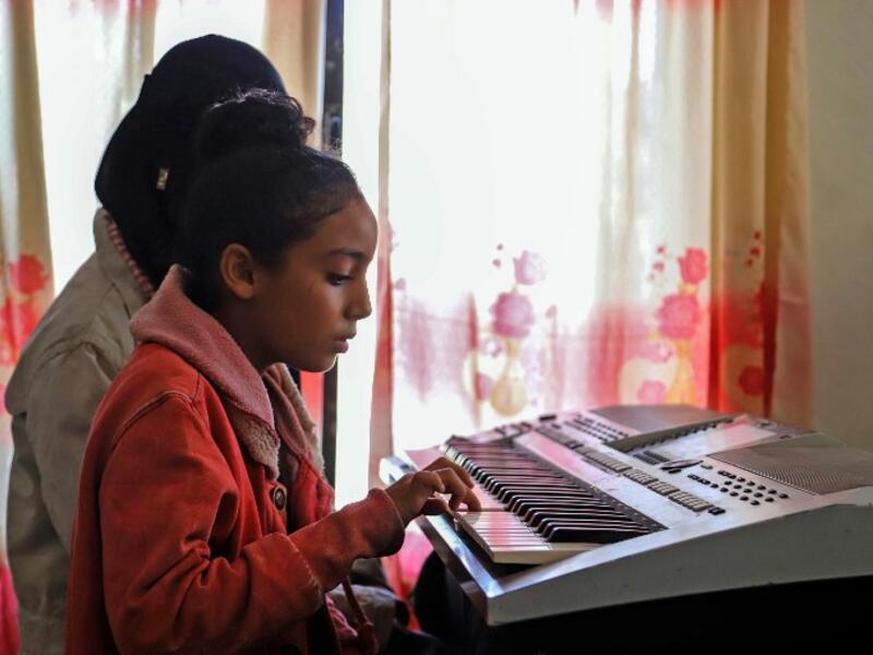 Children attend a music class at the Al-Nawras school in Taez, Yemen's third city, in the country's southwest
AHMAD AL-BASHA / AFP