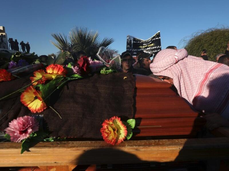 Iraqi Yazidis attend the funeral of the Mir Takhsin-Beg (Tahseen Said Ali), the hereditary leader of the Yazidi community in the world, in the town of Sheikhan, 50km northeast of Mosul.
SAFIN HAMED / AFP