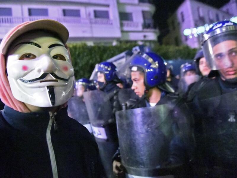 Algerian police stand guard during a demonstration in the capital Algiers against ailing President Abdelaziz Bouteflika's bid for a fifth term
RYAD KRAMDI / AFP