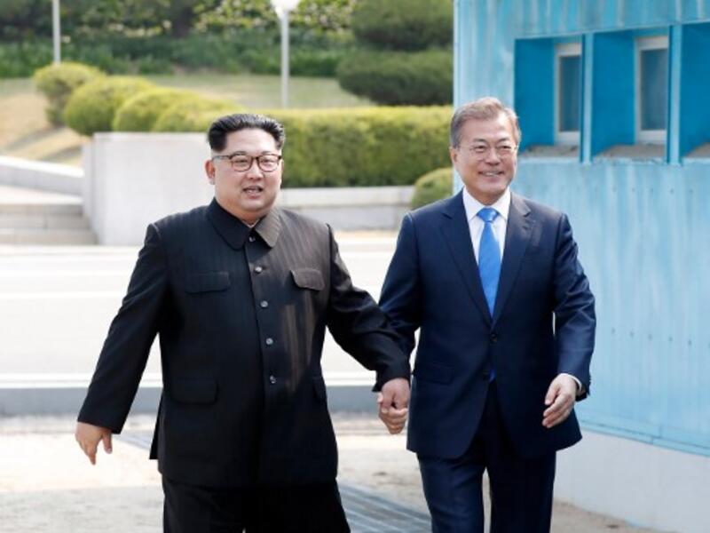 North Korea's walks from the North to the Military Demarcation Line dividing the two Koreas to meet with his South Korean counterpart. The two men stepped back over the line into the North before walking to the Peace House  for the summit -- the third of its kind since hostilities ceased in 1953. Korea Summit Press Pool/AFP

