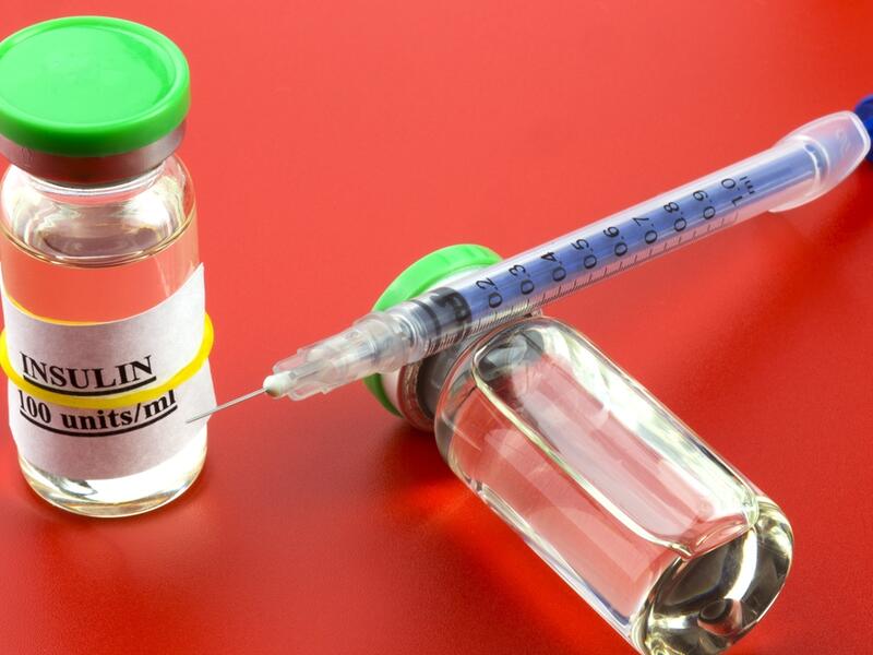 Two vials with insulin hormone and single use insulin syringe (Shutterstock)