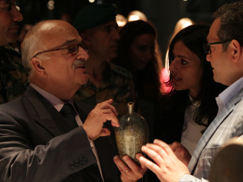 HRH Prince Hasan, the brother of the late King Hussein bin Talal of Jordan, holds a crystal-ware vase created by Aymen Azzam. (Al Bawaba/Salim Essaid) 