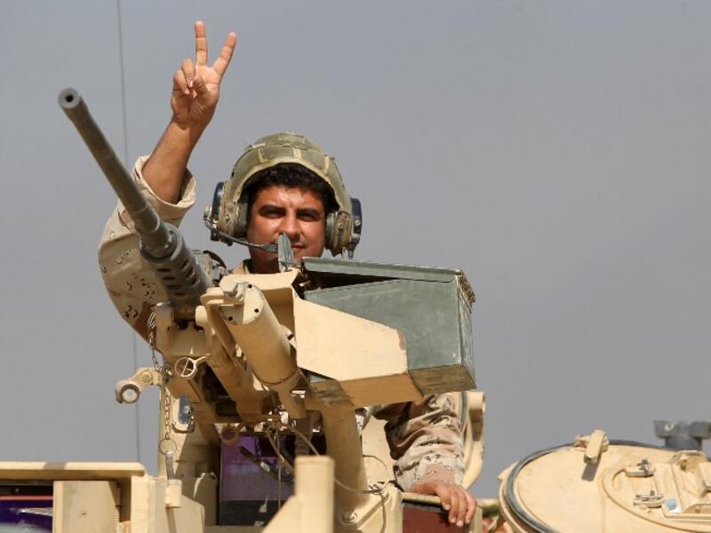 Growing cooperation between Iraq, Iran, Syria, and Russia has extended to coordination on intelligence and military operations. (AFP/Ahmad al-Rubaye))