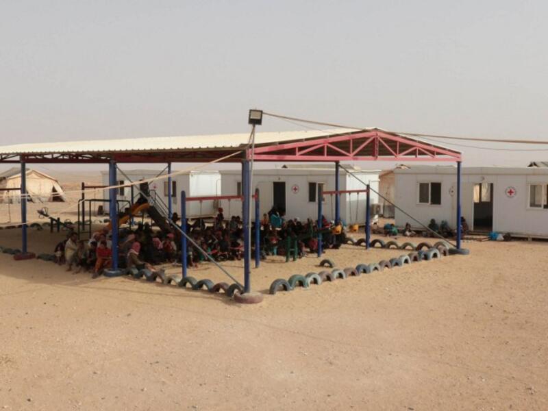 Refugees wait at all-Roqban makeshift camp, on the border with Syria, in 2015. (AFP/Khalil Mazraawi)