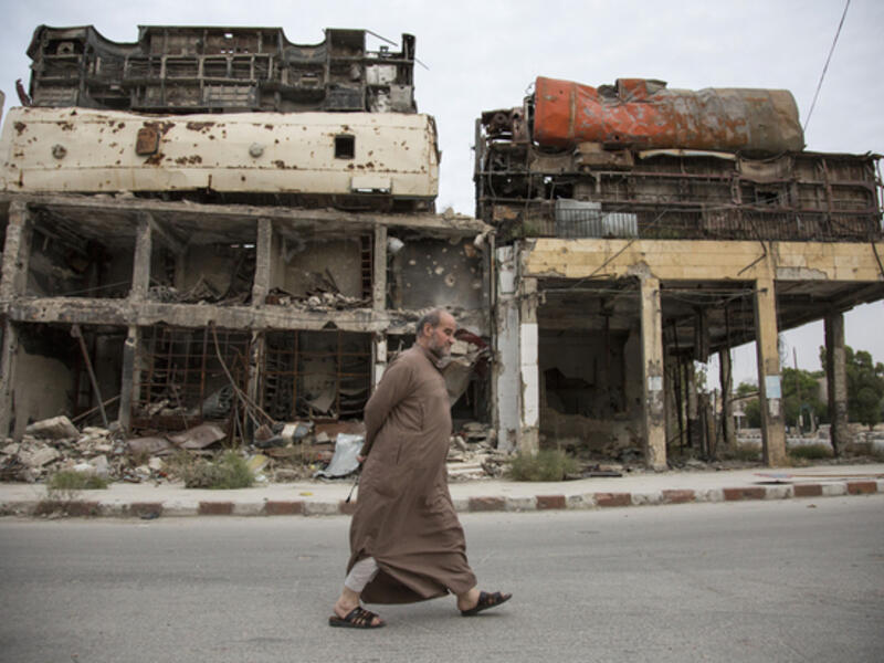 A man walks in Aleppo during a time of no fighting (AFP/File)