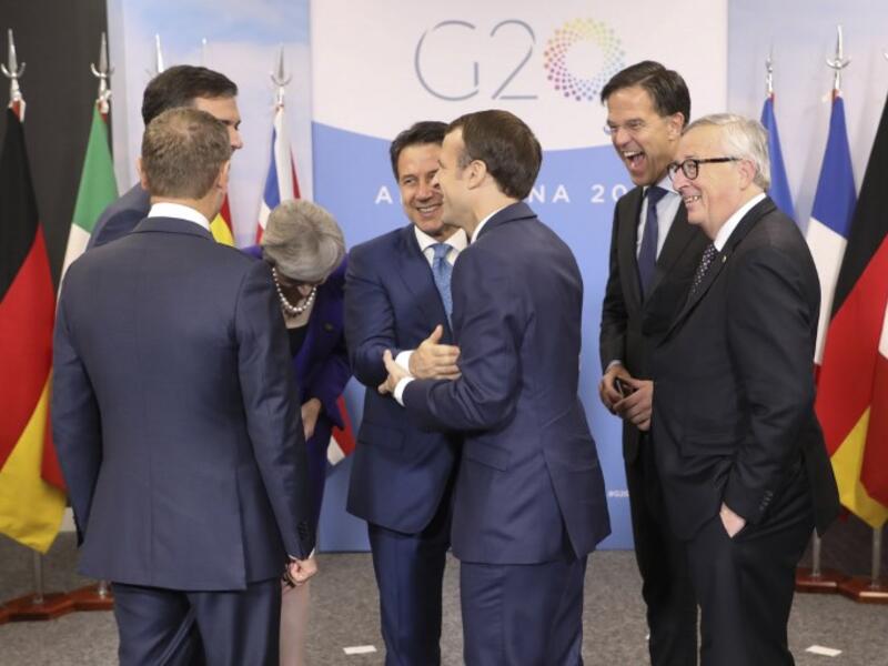 (L-R) the president of the European Council Donald Tusk, Spanish Prime Minister Pedro Sanchez (behind), British Prime Minister Theresa May, Italian Prime Minister Giuseppe Conte, French President Emmanuel Macron, the Netherland's Prime Minister Mark Rutte and the president of the European Commission Jean Claude Juncker. 
Ludovic MARIN / AFP