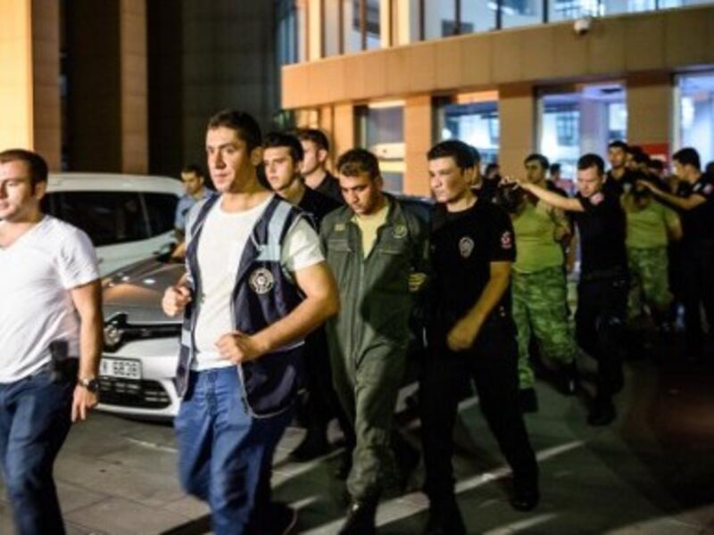 Turkish anti-riot police escort soldiers who allegedly took part in a military coup, as they leave a courthouse in Istanbul on July 16, 2016. (AFP/Ozan Kose)
