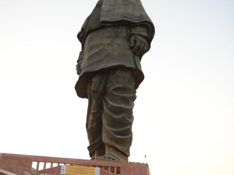 Indian construction workers are seen near the "Statue Of Unity", the world's tallest statue dedicated to Indian independence leader Sardar Vallabhbhai Patel. (SAM PANTHAKY / AFP)