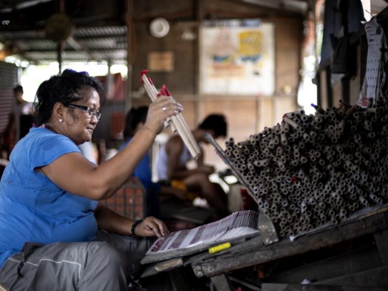 A worker makes fireworks for New Year celebrations in Bocaue, Bulacan, north of Manila on December 26, 2018. 
Noel CELIS / AFP