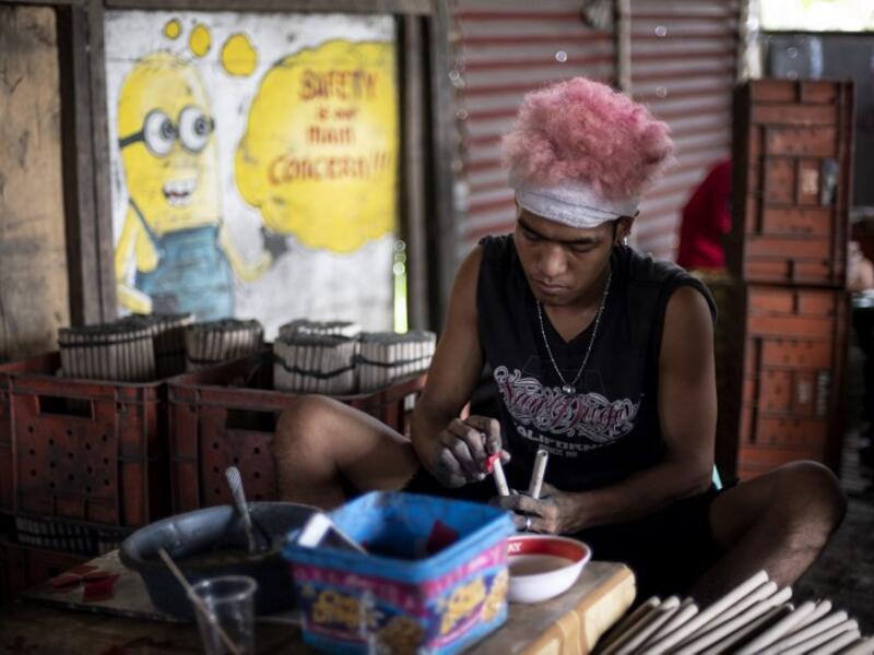 A worker makes fireworks for New Year celebrations in Bocaue, Bulacan, north of Manila on December 26, 2018. 
Noel CELIS / AFP