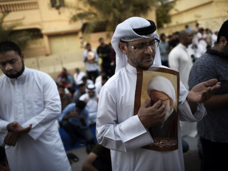 Bahraini Shia demonstrators protest the arrest and persecution of top Shia cleric Sheikh Isa Qassim.  (AFP/Mohammed Al-Shaikh)