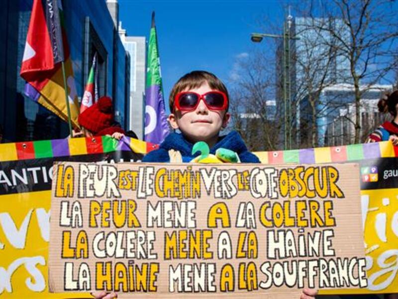 People take part in a national protest against racism, hatred, discrimination, inequality and aggression in Brussels, March 24, 2018. (AFP/ File Photo). 
