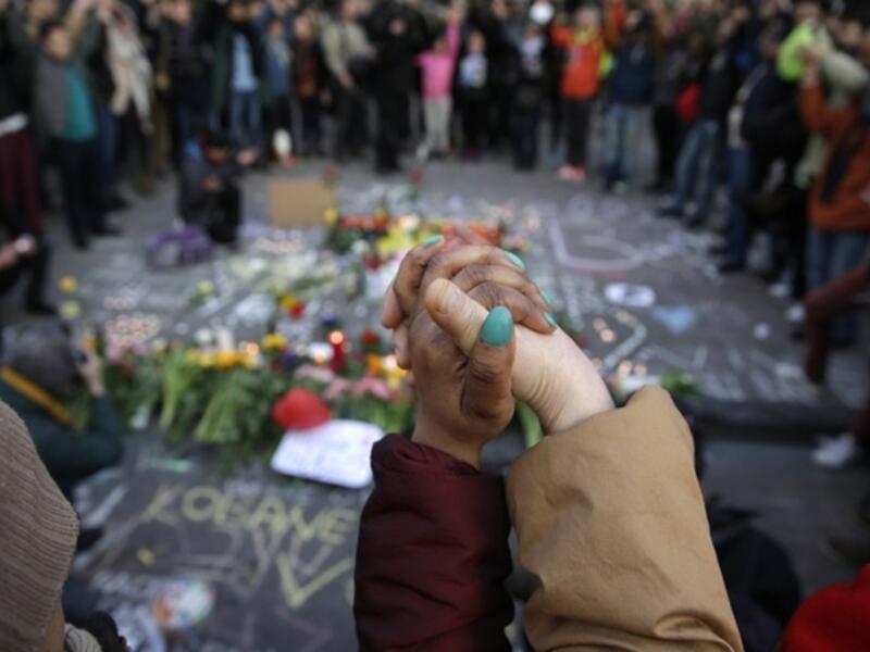Police dispersed far-right hooligans who disrupted mourners at shrine for victims of Brussels attacks. (AFP/File)