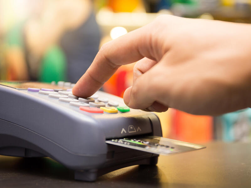 The average person in the UAE owes $11,590 in debt, often the form of credit card balances and car loans. (Shutterstock)