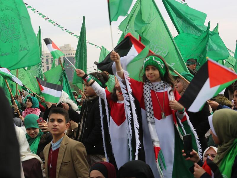 Palestinians attend a rally marking the 31st anniversary of Hamas' founding. (Twitter)