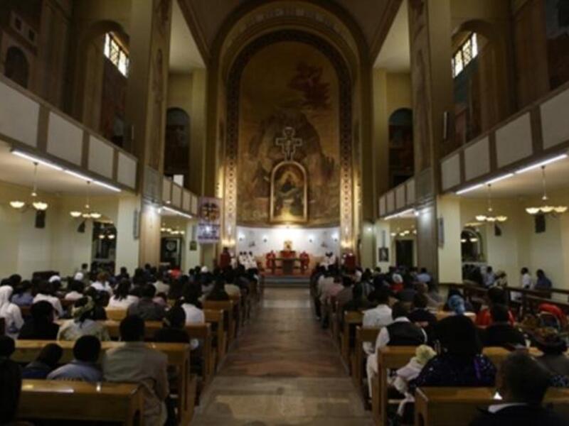 Libya: Christian residents in the country gather to take refuge in Easter solemnities. A Christian Catholic priest kisses the crucified statue of Jesus during Good Friday service.