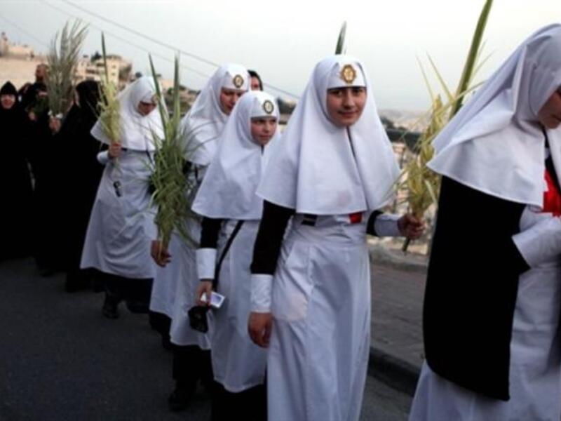 Jerusalem the week before His crucifixion, when a cheering crowd greeted Him waving palm leaves.