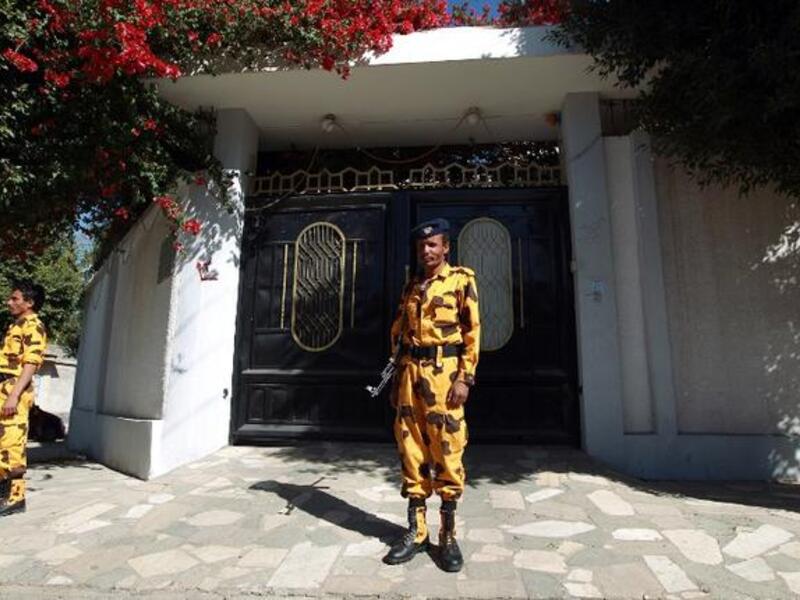 Yemeni soldiers stand guard in front of the Iranian ambassador's residence in Sanaa, on January 18, 2014. [AFP]