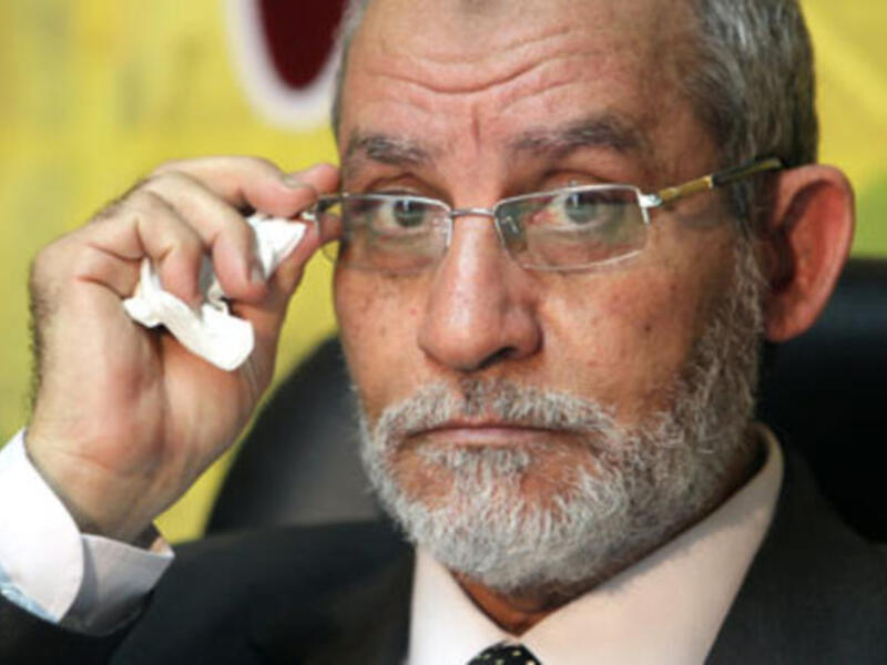 Muslim Brotherhood Supreme Guide accused of enticing violence during clashes between pro-Morsi protesters and the police. [theguardian/EPA]