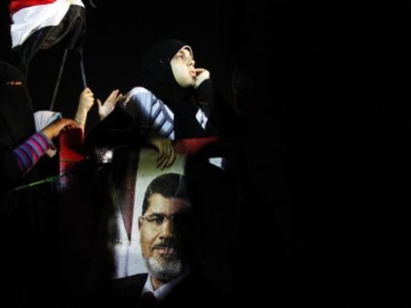 Protestor raises specter of deposed Morsi at Cairo rally turned violent, July 7 (Image Mahmoud Khaled / AFP)