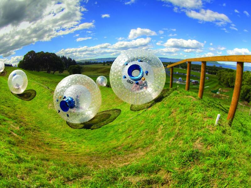 Roll Down A Hill In An Inflatable Ball In New Zealand: e are put inside enormous inflatable plastic balls and then pushed down hills. Apparently, it’s big in New Zealand, where riders volunteer to be pushed down hills in these plastic balls, which have no controls and offer no way to stop. (stayathomemum.com)