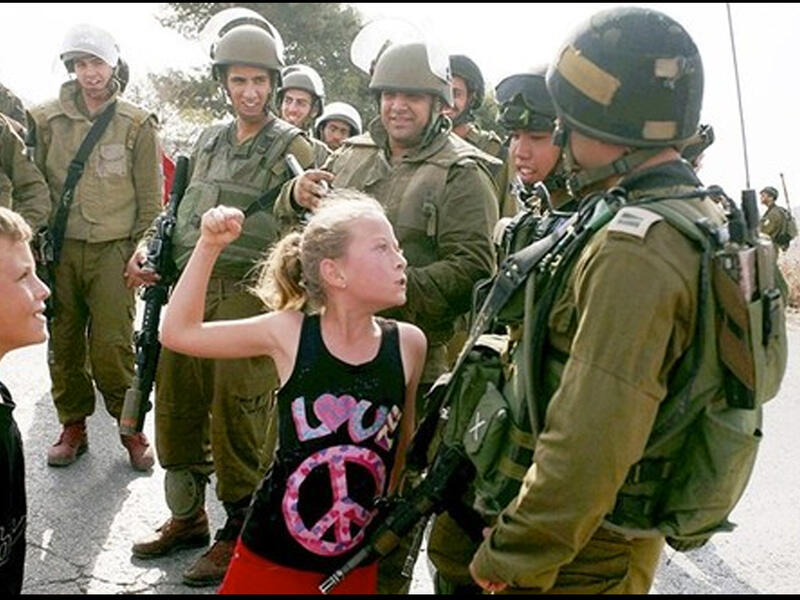 ahed tamimi shaking fist israeli soldier