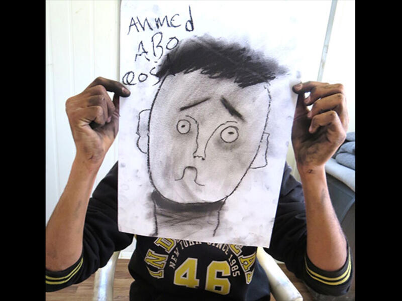 Ahmed nailed the eyebrow lesson, perfectly communicating confusion in his over-sized self portrait. By the end of this session, the black charcoal drawing sticks left the crew looking like coal-miners.