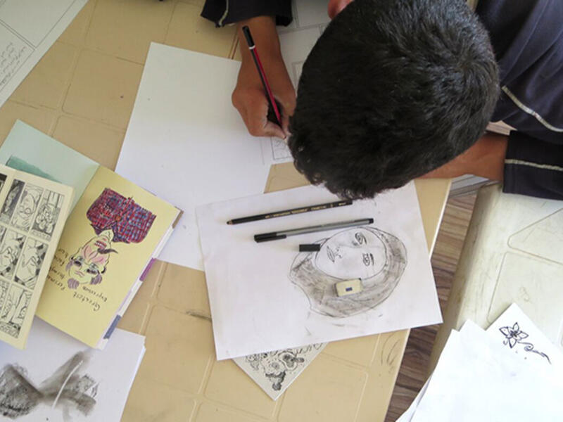 Cultural context required some special attention, as the men were uncomfortable drawing women who are not family members. IRD staffer Mays stepped in as life model and the guys practiced sketching her expressions and the folds of her hijab. Bradbury told them, "You leave out half your stories if you can't draw life-like women." 


